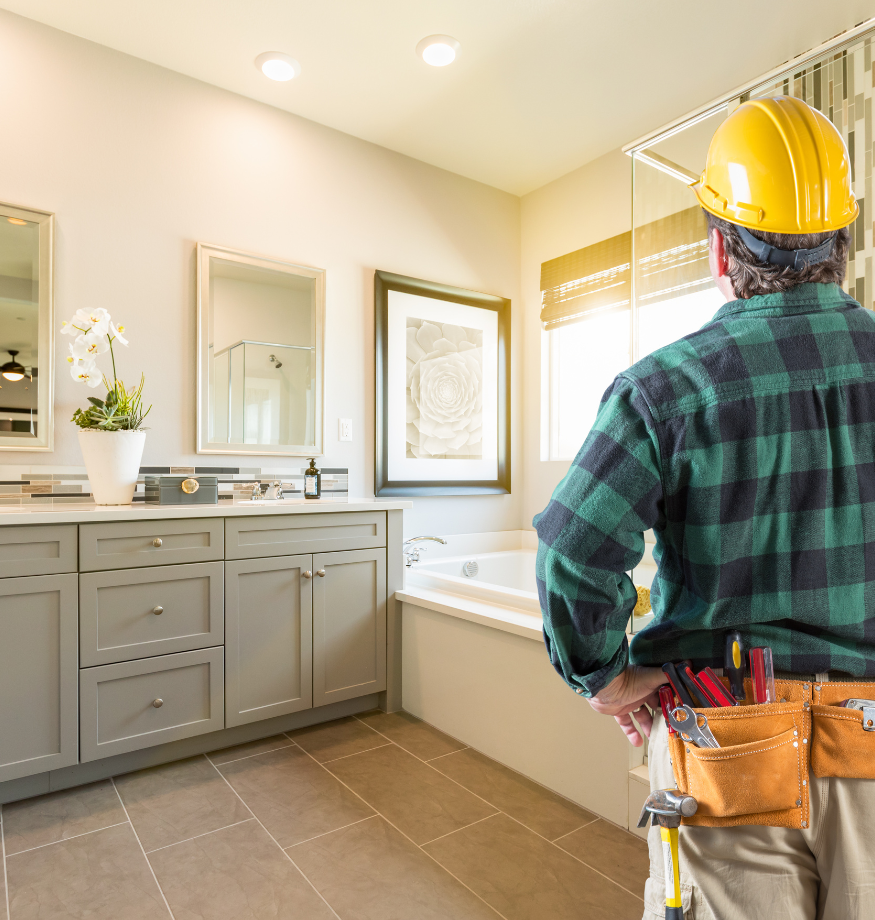 Contractor expertly working on a bathroom renovation in Orange County